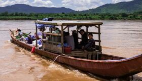 Panoramic view of Pak Beng’s serene river for a scenic Pak Beng Tours banner by Legend Travel Group.